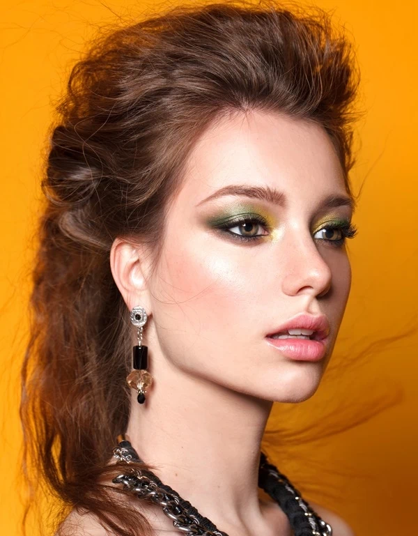 woman with hazel eyes and an example of gold and green eyeshadow looks