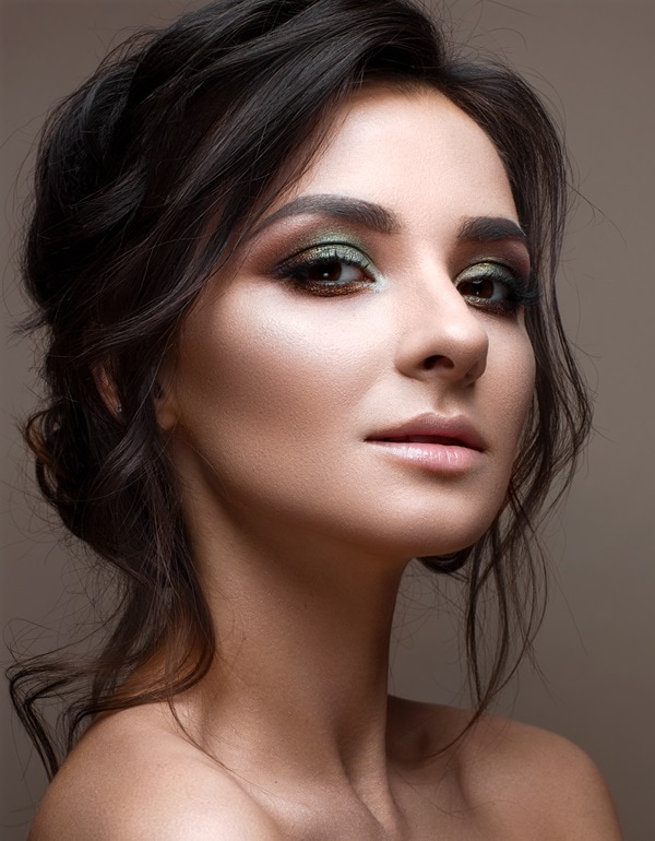 woman with brown eyes and a light green eyeshadow look