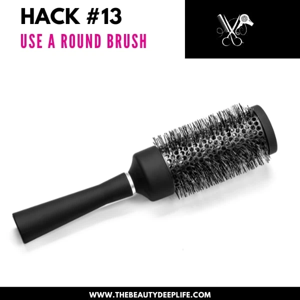 round hair brush representing an example of a product to help give fine hair volume at the roots