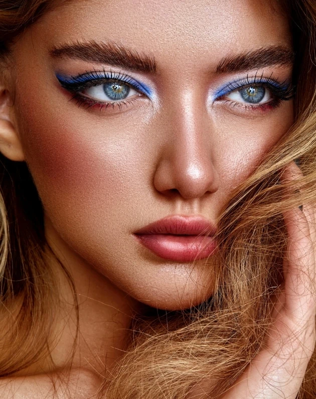 woman with blue eye makeup for summer