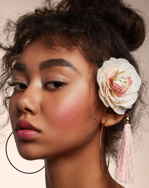 beautiful girl with the perfect makeup look for summer featuring blush and glowing skin