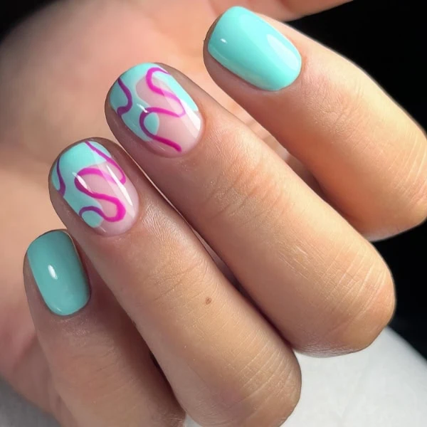 female hand with bright nails and trendy design