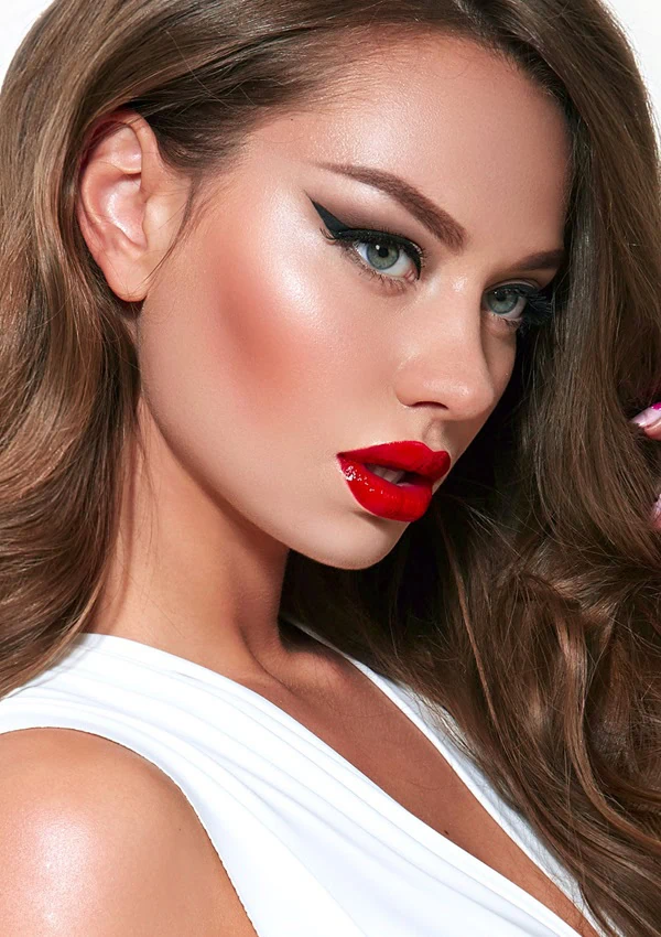 woman professional makeup red lips winged eyelinerfor valentine's day makeup idea