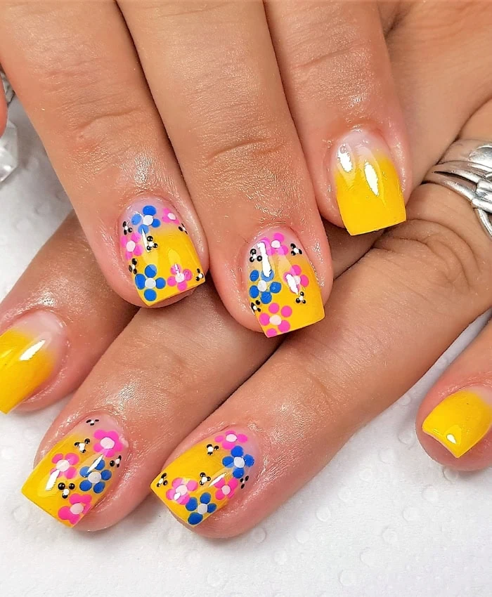 bright yellow nails with floral print for spring