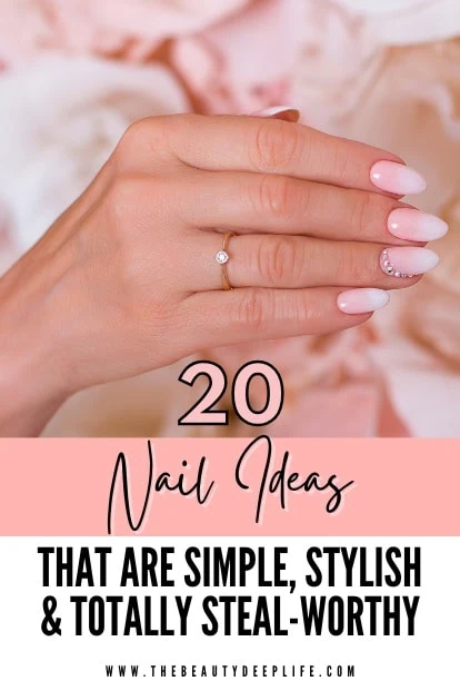 femal hand with an ombre nail idea and rhinestones