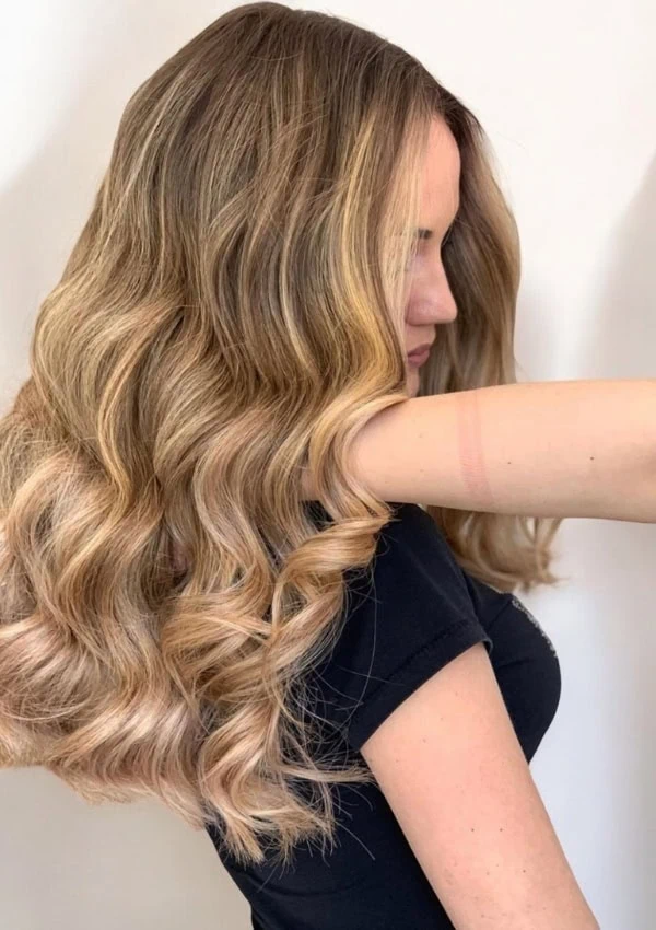 young woman with balayage blonde hair