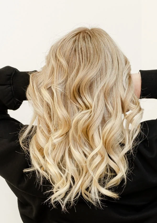Back of a woman's head who has butter blonde hair
