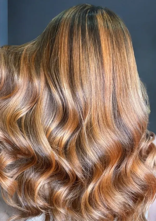 Back Of A Women With A Blonde Hair Color Idea That Is Caramel Blonde