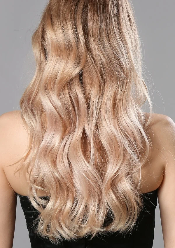 the back of a woman's head with champagne blonde hair