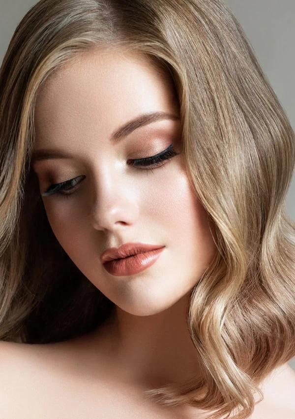 young woman with wavy dirty blonde hair