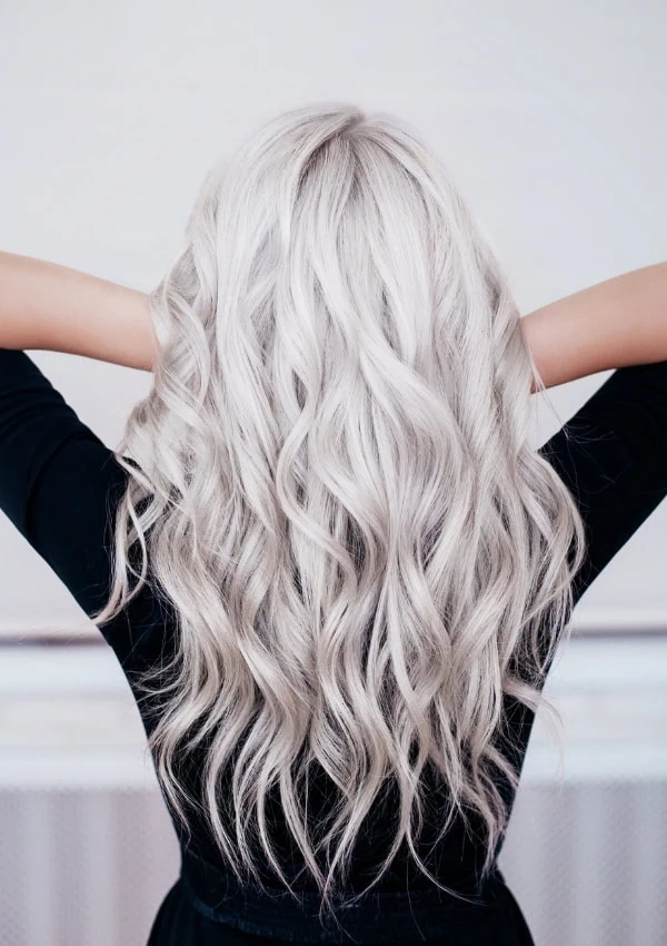 the back of a woman with long icy blonde hair