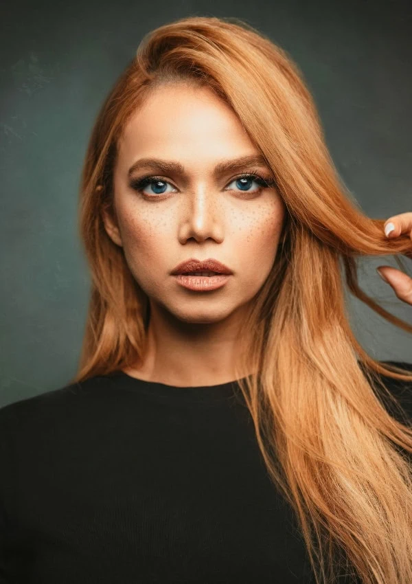beautiful woman with long strawberry blonde hair color