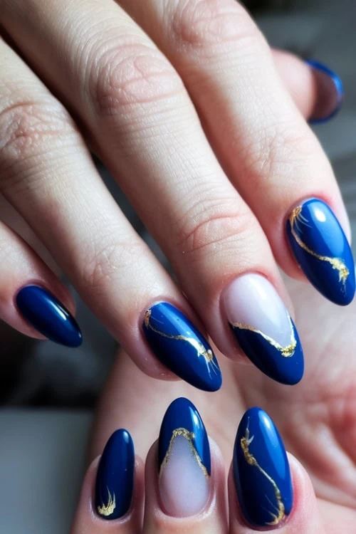 hand with blue and gold nails
