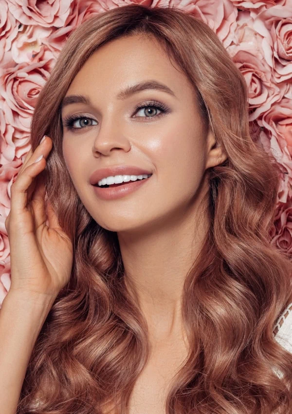 beautiful young woman with rose gold blonde hair