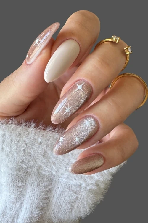 female hand with a simple and classy champage and beige nail idea