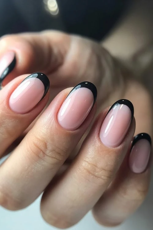 hand with black french manicure