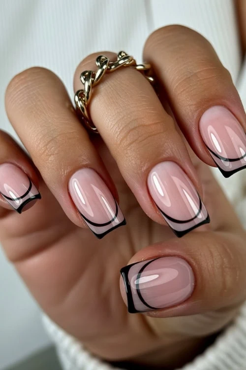 hand with black negative space french tips