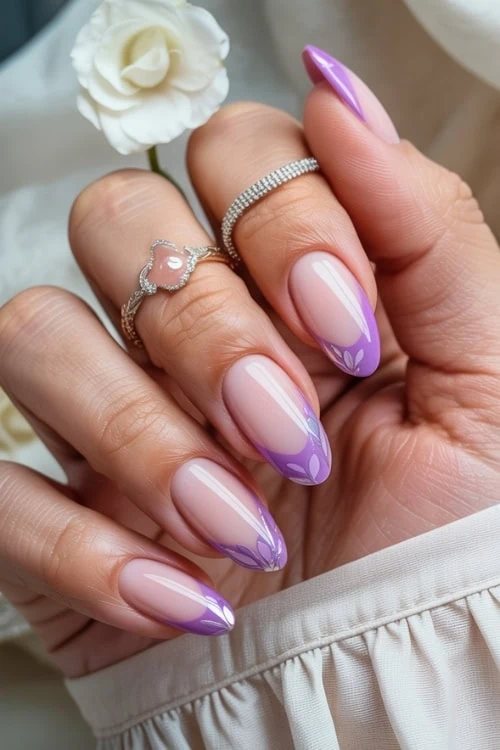 hand with purple french tip nails