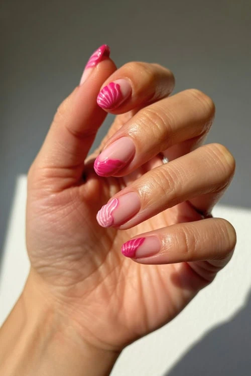 hand with almond nails and 3d seashells