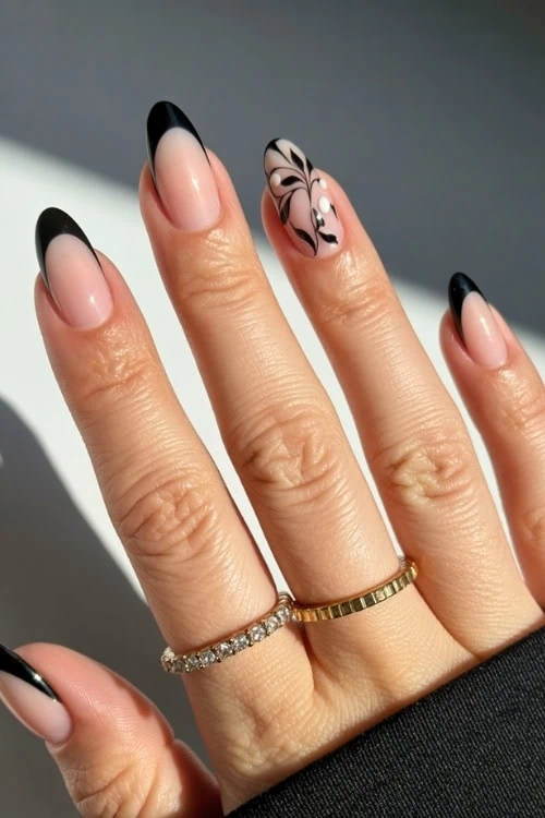 hand with black french tip nails