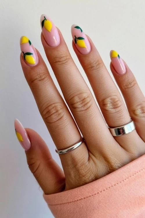 hand with lemon nail art design
