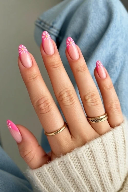hand with almond nails and floral french tips