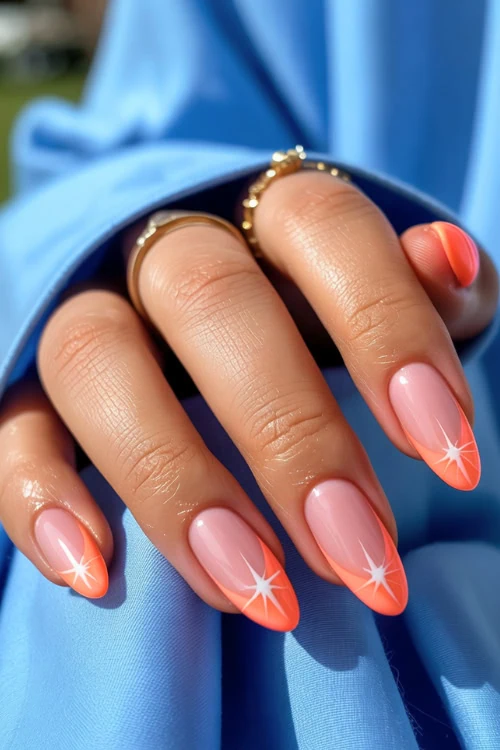 hand with neon orange french tip