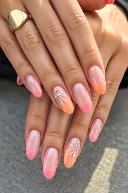 hands with orange and pink tropical nail design