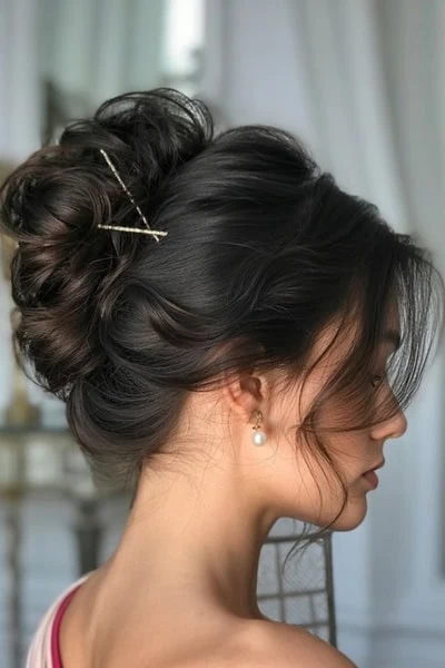 young woman with her hair up in a messy french twist hairstyle for long hair