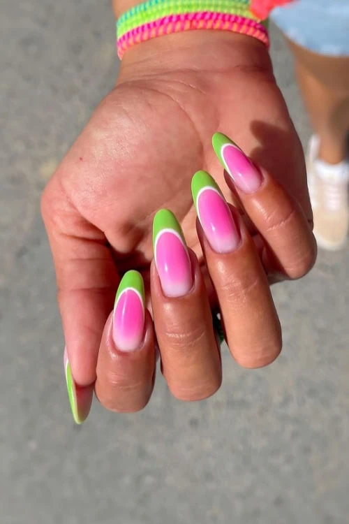 hand with fruit nails that are watermelon green and pink