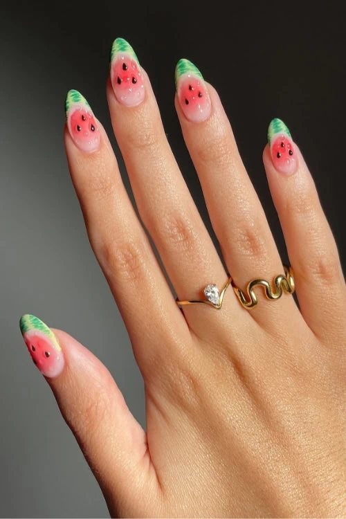 hand with watermelon fruit nails
