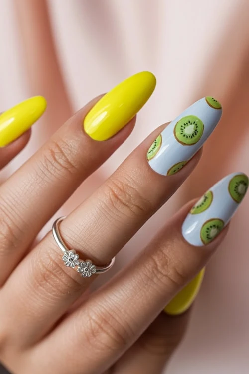 hand with kiwi fruit nails