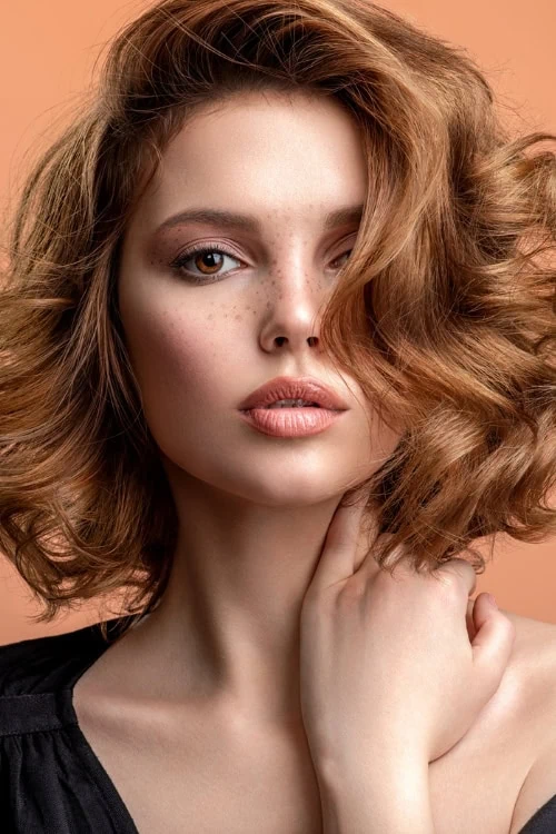 woman with copper hair and brown eyes