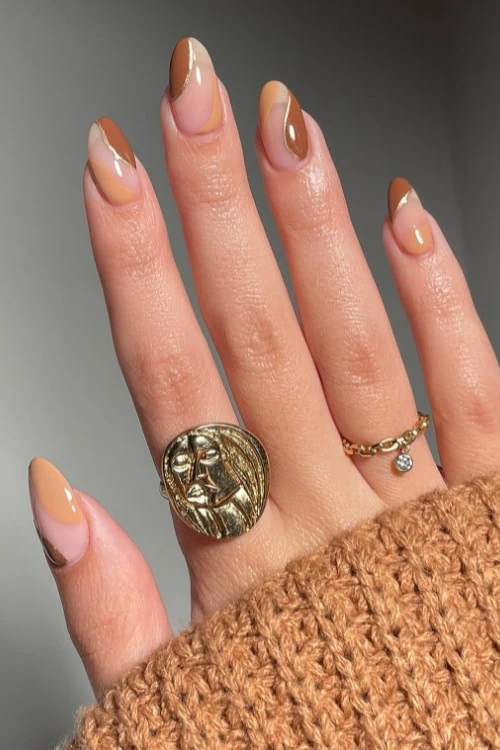female hand with earthy tone brown nails for fall