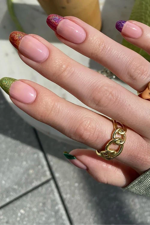 woman with different colored french tip nails