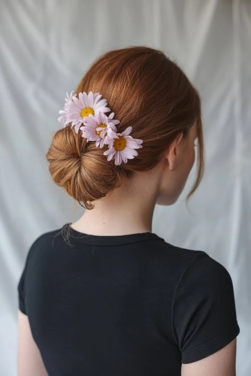 woman with a bun and flowers for summer