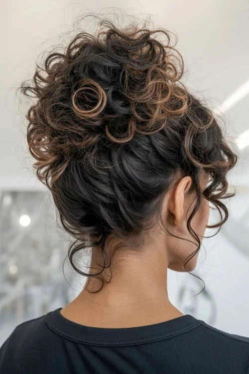 woman with a messy curly updo
