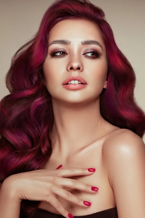 woman with deep magenta red hair color