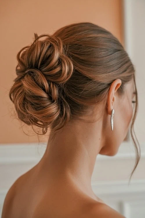 woman with a summer hairstyle that is a Twisted Chignon Bun