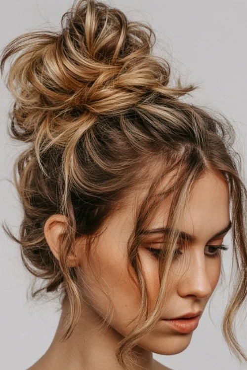 girl with summer hairstyle messy bun