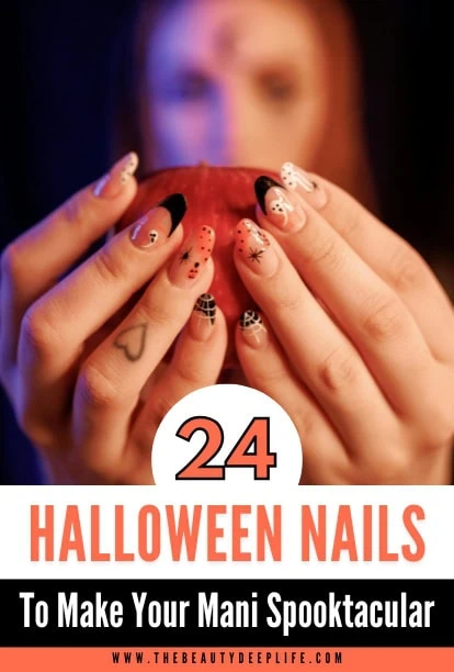 woman holding an apple with halloween themed nails