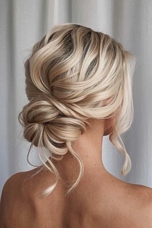 woman with a medium length hairstyle updo bun