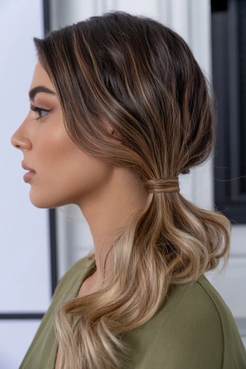 young woman with a low side ponytail