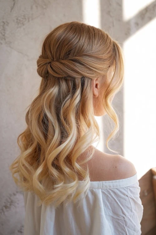 young woman with a half up twist back hairstyle for medium length hair