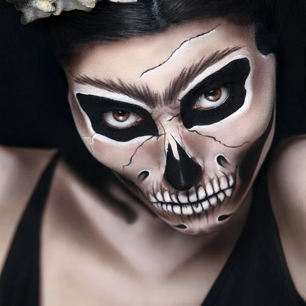woman with halloween makeup as a skeleton