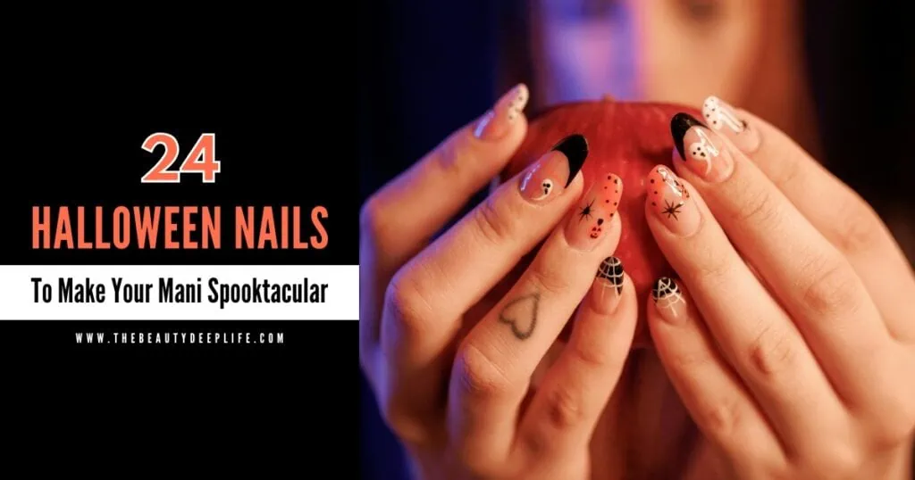woman's hands holding an apple with halloween nails