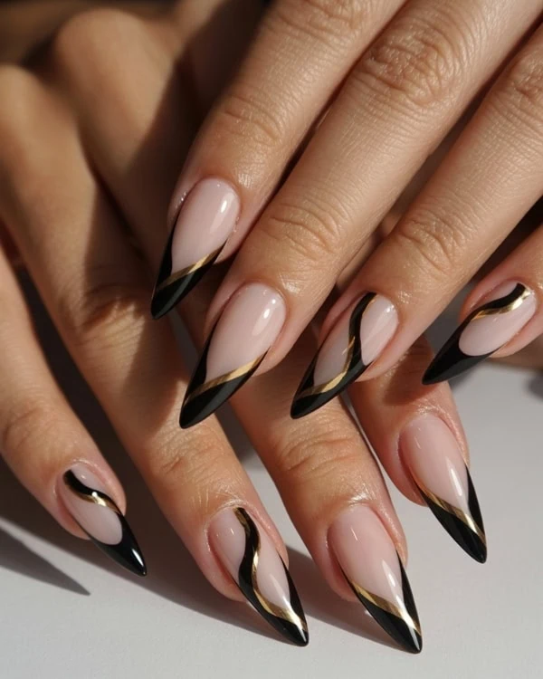 hands with Black & Gold Nails