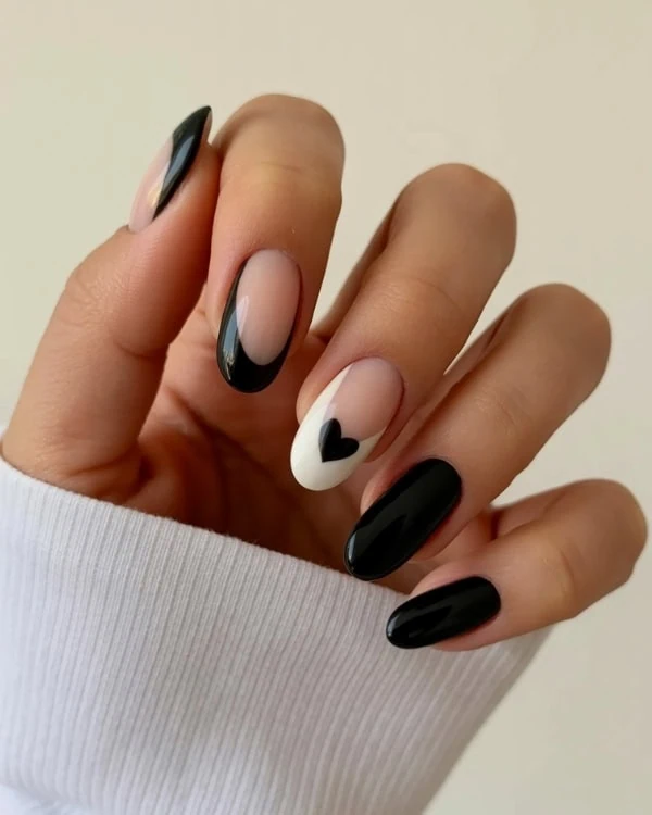 hand with Black & White Nails Black Heart