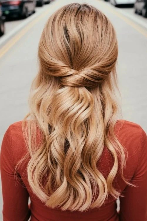 back of a woman's hair with a half up twist hairstyle for fall