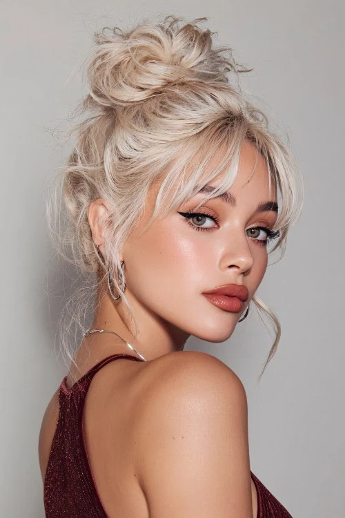 young woman with her hair up and textured bangs